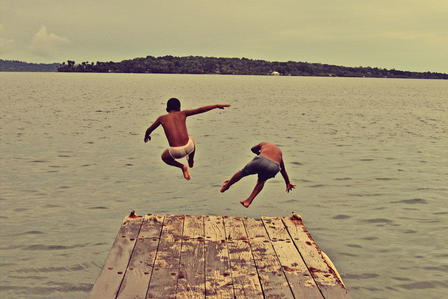 Girls jumping off Dock mooning.